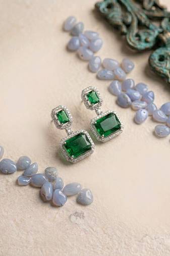 Trendy american diamond green earrings