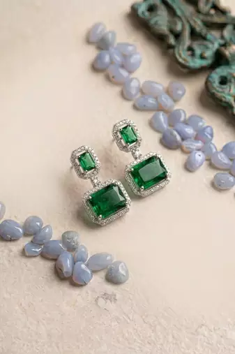 Trendy american diamond green earrings