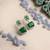 Trendy american diamond green earrings