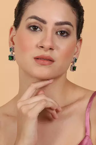 Trendy american diamond green earrings