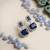 Trendy american diamond blue earrings