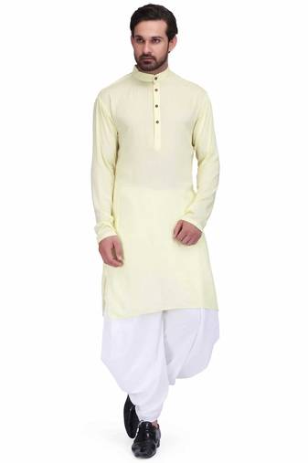 Light yellow rayon kurta paired with white cotton dhoti style salwar