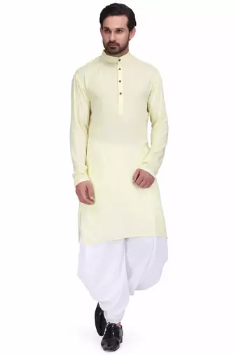 Light yellow rayon kurta paired with white cotton dhoti style salwar