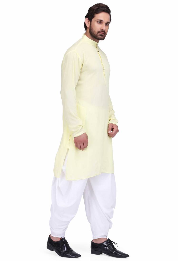 Light yellow rayon kurta paired with white cotton dhoti style salwar