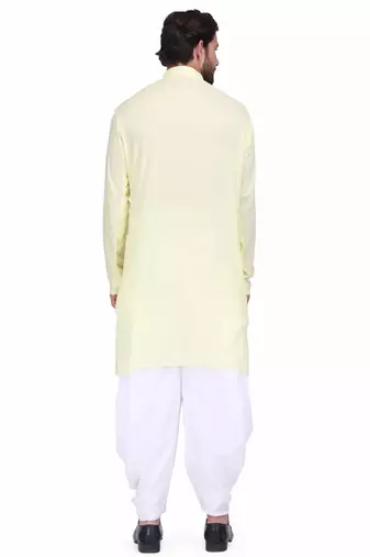 Light yellow rayon kurta paired with white cotton dhoti style salwar