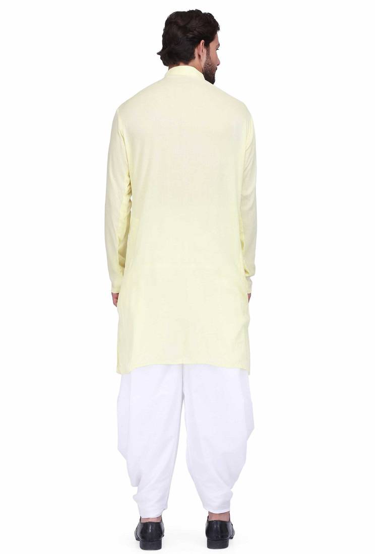Light yellow rayon kurta paired with white cotton dhoti style salwar