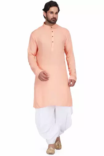 Peach rayon kurta paired with white cotton dhoti style salwar