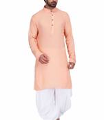 Peach rayon kurta paired with white cotton dhoti style salwar