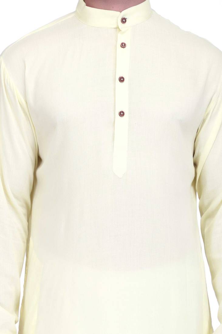 Light yellow rayon kurta paired with white cotton dhoti style salwar