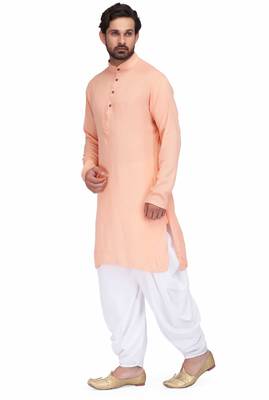Peach rayon kurta paired with white cotton dhoti style salwar 2