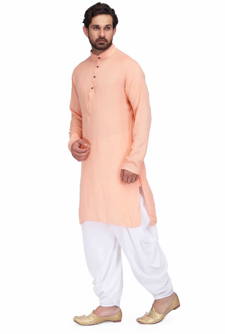 Peach rayon kurta paired with white cotton dhoti style salwar