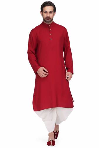Maroon rayon kurta paired with white cotton dhoti style salwar