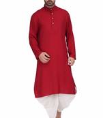 Maroon rayon kurta paired with white cotton dhoti style salwar