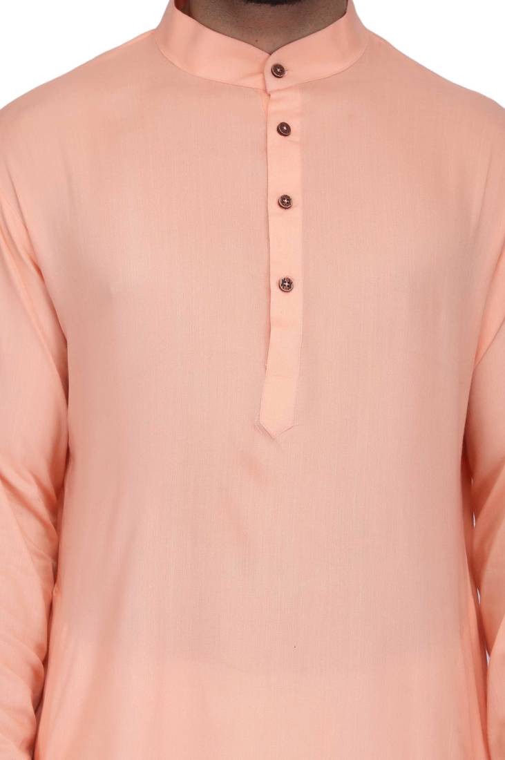 Peach rayon kurta paired with white cotton dhoti style salwar