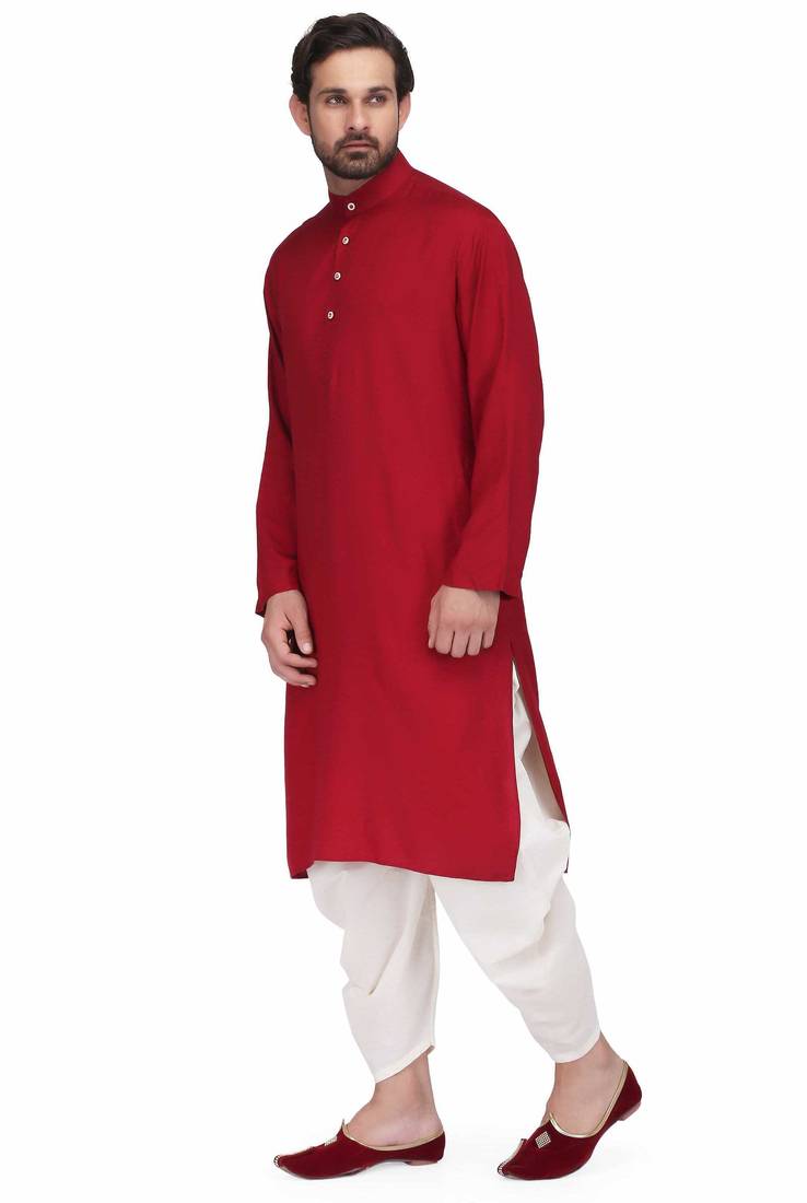 Maroon rayon kurta paired with white cotton dhoti style salwar