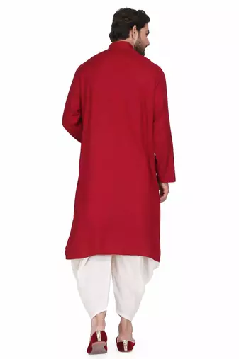 Maroon rayon kurta paired with white cotton dhoti style salwar