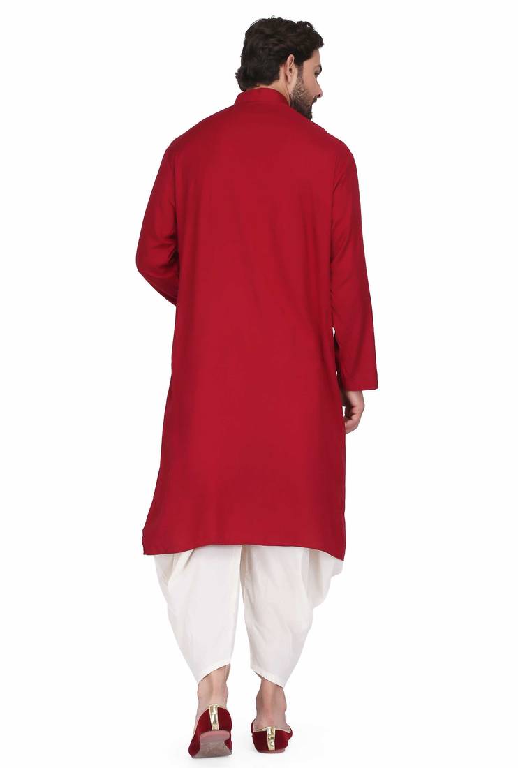 Maroon rayon kurta paired with white cotton dhoti style salwar