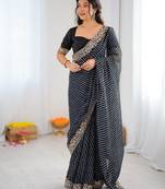 Black color faux georgette bandhni print & embroidered border saree