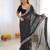 Black color faux georgette bandhni print & embroidered border saree