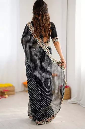 Black color faux georgette bandhni print & embroidered border saree