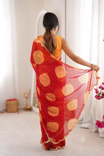  georgette bandhani gola print saree with mirror work & cutwork border