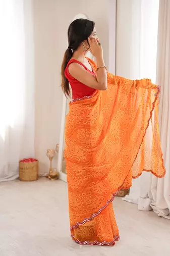  georgette bandhani print saree with mirror work & cutwork border
