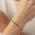 Green dazzle link tennis bracelet