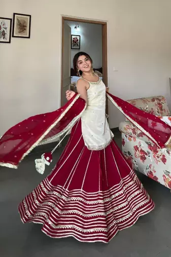 Off white silk blend embroidered  lehenga kurti with real mirror work set