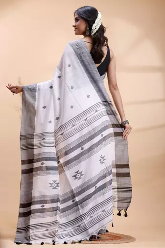 White & black handloom saree with minimalist woven motifs and classic contrast border