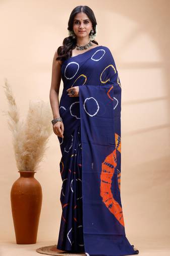 Ink blue malmal cotton saree with artistic tie-dye circles & vibrant handcrafted patterns