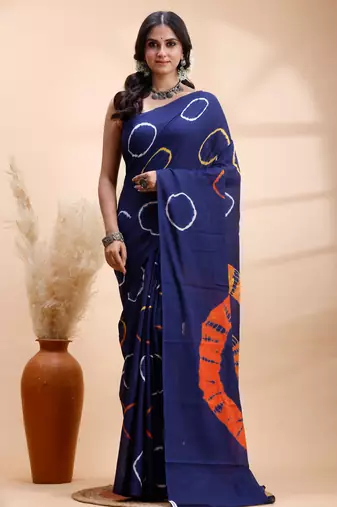 Ink blue malmal cotton saree with artistic tie-dye circles & vibrant handcrafted patterns