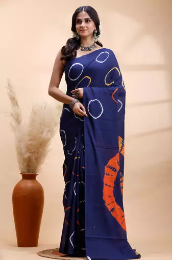 Ink blue malmal cotton saree with artistic tie-dye circles & vibrant handcrafted patterns