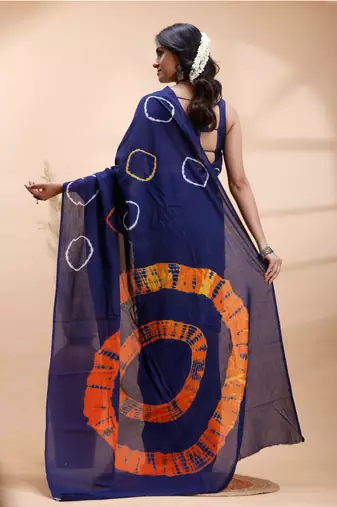 Ink blue malmal cotton saree with artistic tie-dye circles & vibrant handcrafted patterns