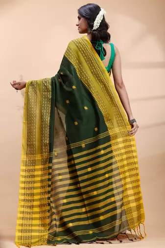 Dark green handloom cotton saree with yellow traditional border & intricate weaving design