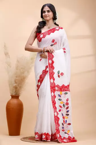 White & red handloom saree with intricate applique work and floral artistic border