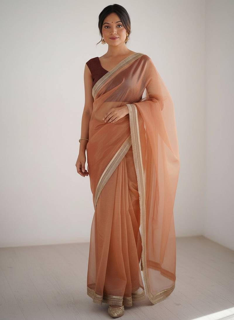 Peach net embellished saree with contrast blouse piece