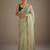 Lighte green net embellished saree with contrast blouse piece
