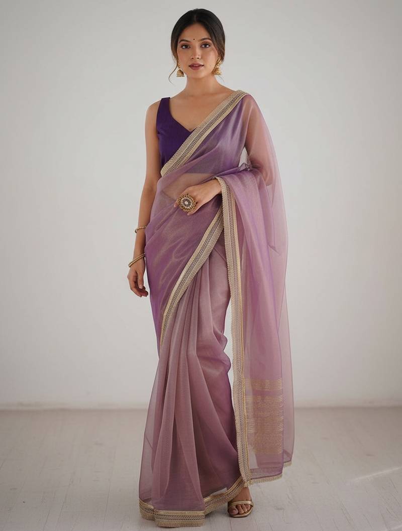 Mauve  net embellished saree with contrast blouse piece