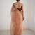 Peach net embellished saree with contrast blouse piece