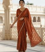 Rust georgette sequence work saree with running blouse piece