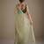 Lighte green net embellished saree with contrast blouse piece