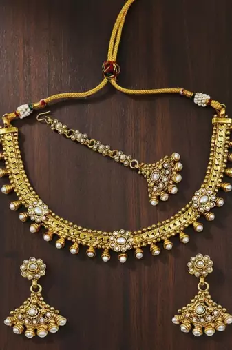 Gold plated kundan pearl choker necklace set with earrings & maang tikka for women