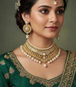 Gold plated pearl stone studded designer choker jewellery set for women