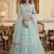 light sea green net hand woven lehengas