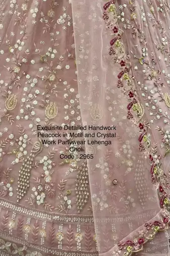 light baby pink net hand woven lehengas