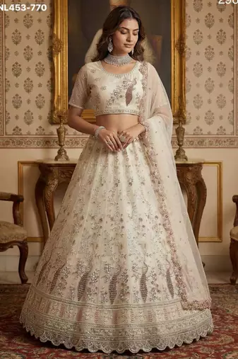 light off white net hand woven lehengas
