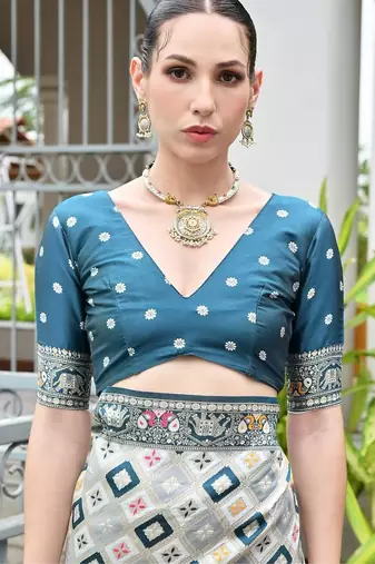 Rama blue color banarasi silk blend ajhrakh meena zari weaving patola saree