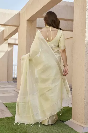 Yellow color tissue linen zari weaving border saree with blouse