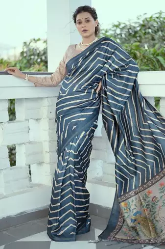 Aqua blue color tussar silk lehariya printed zari border saree