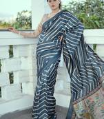 Aqua blue color tussar silk lehariya printed zari border saree
